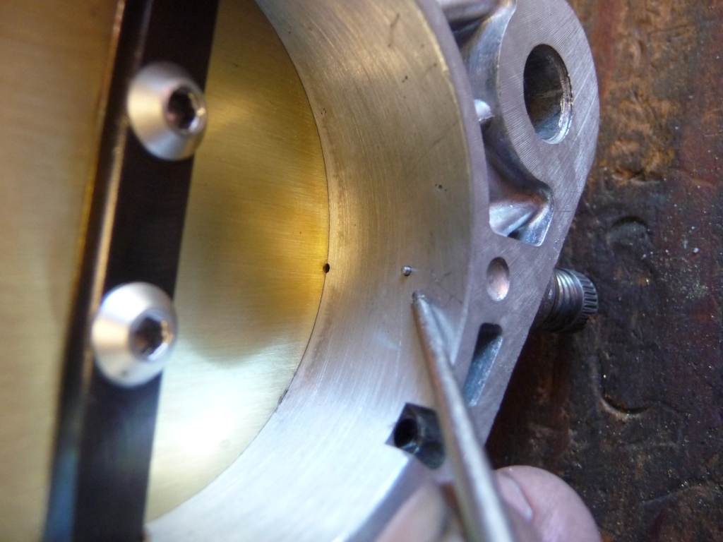 Weber 46IDA3C after idle adjustment showing partially exposed first progression port and idle mixture screw blocking off fuel flow from idle port. This photo taken from same throttle body as previous photo.
