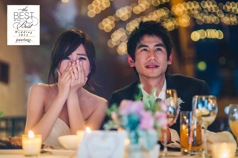 Bride reacting emotionally at a wedding reception