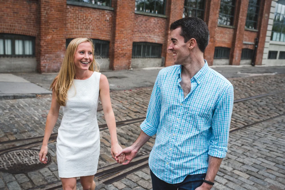 Manhattan engagement session with a couple walking hand in hand through New York