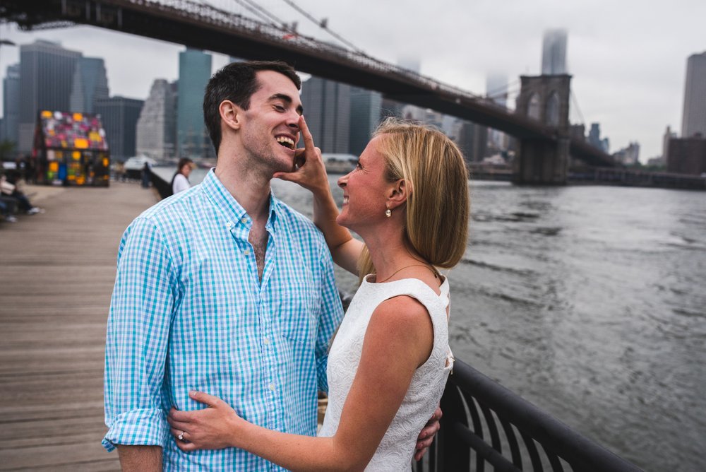 Fun Brooklyn engagement photo of a couple laughing together in New York City