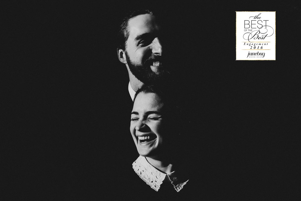 Black and white engagement portrait with dramatic light