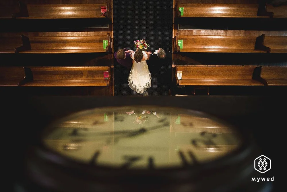 Wedding ceremony photographed from above through a reflection