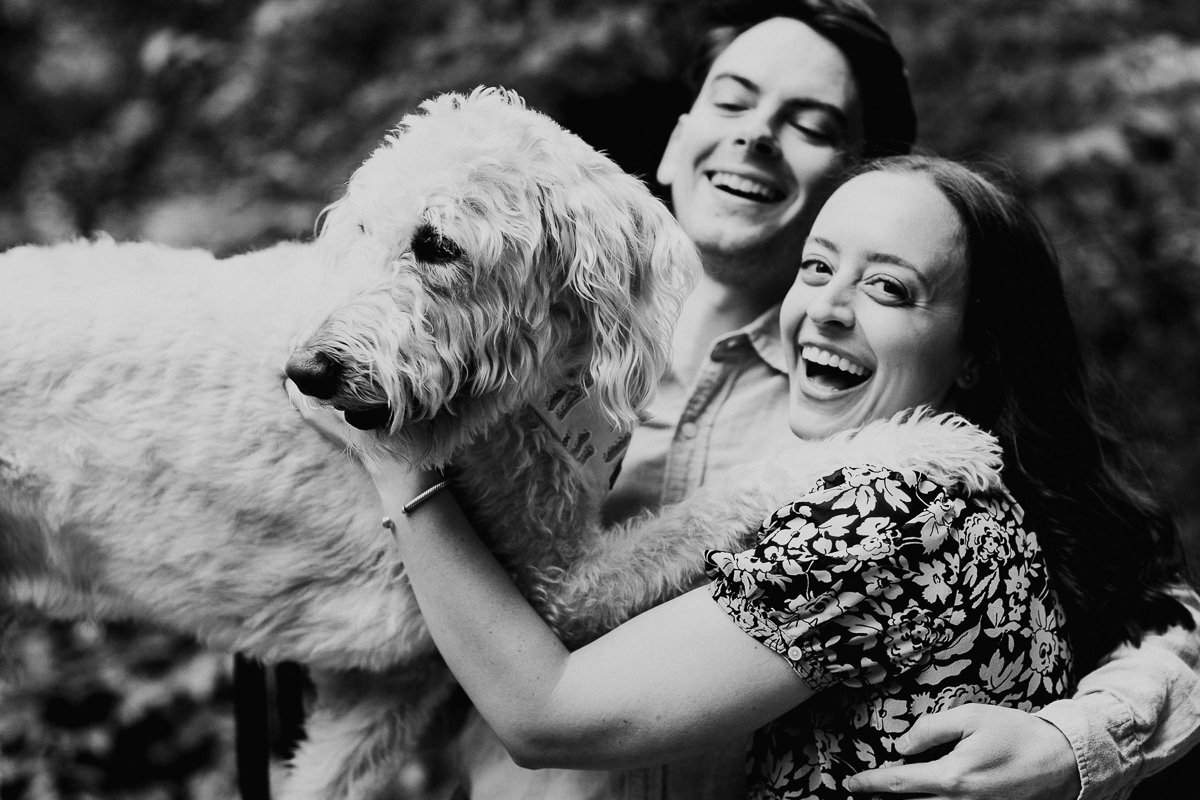 Fun moment of couple and their dog at Dumbarton Oaks Park in Washington D.C.