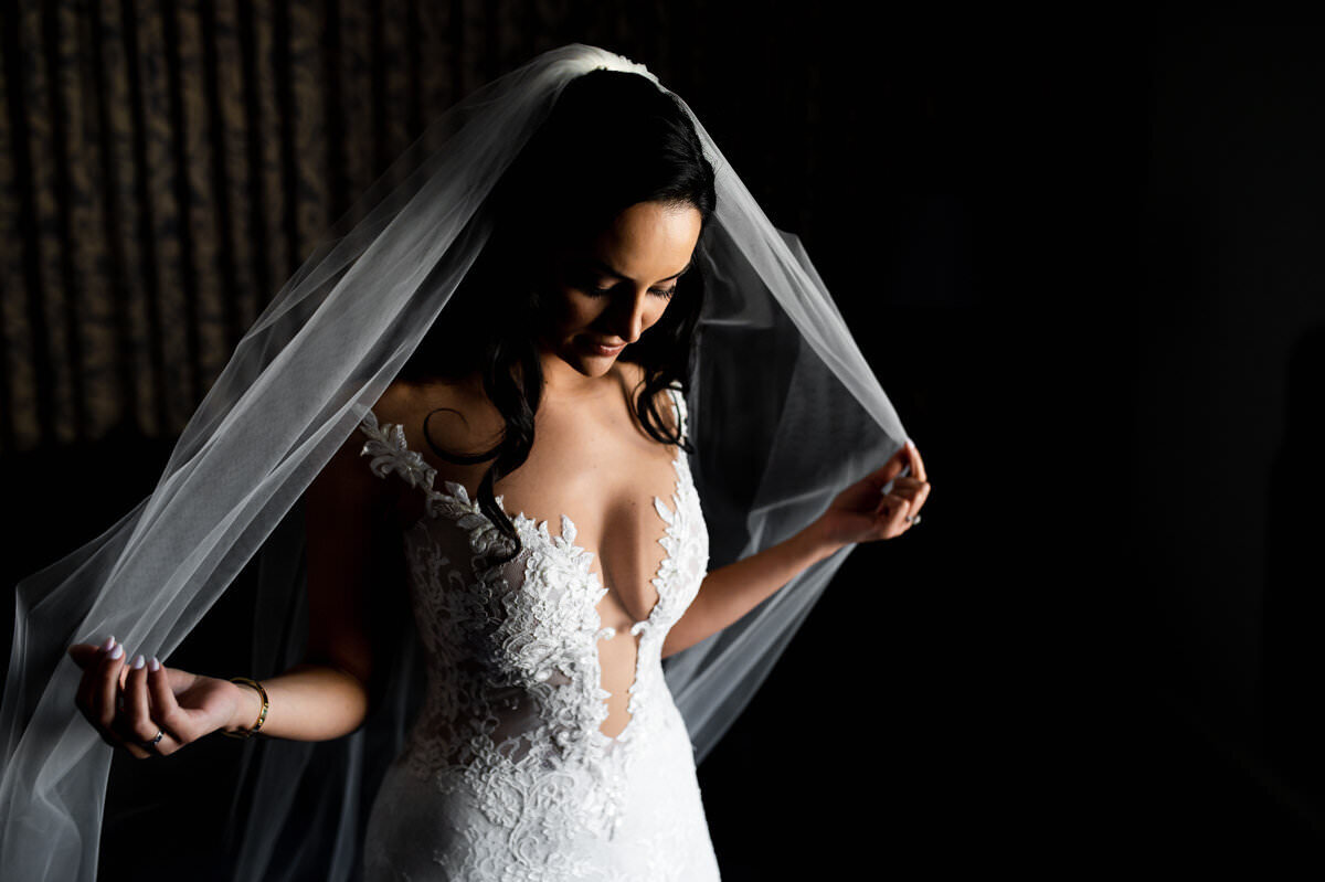 Embracing the moment's magic, this stunning bride is moments away from transforming dreams into reality.