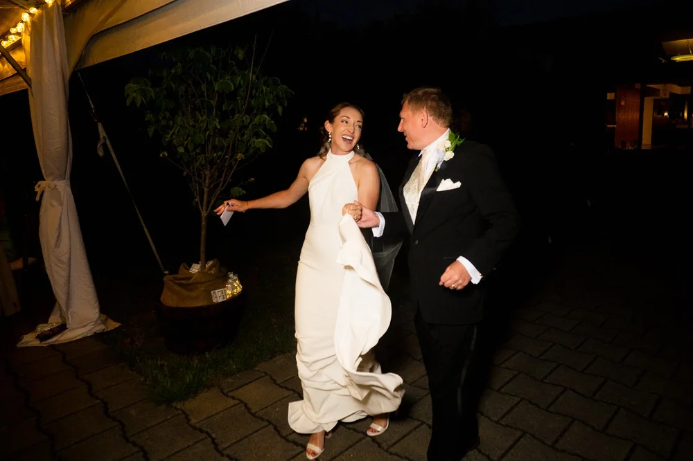 Bride and groom making their grand entrance at an evening National Arboretum wedding reception