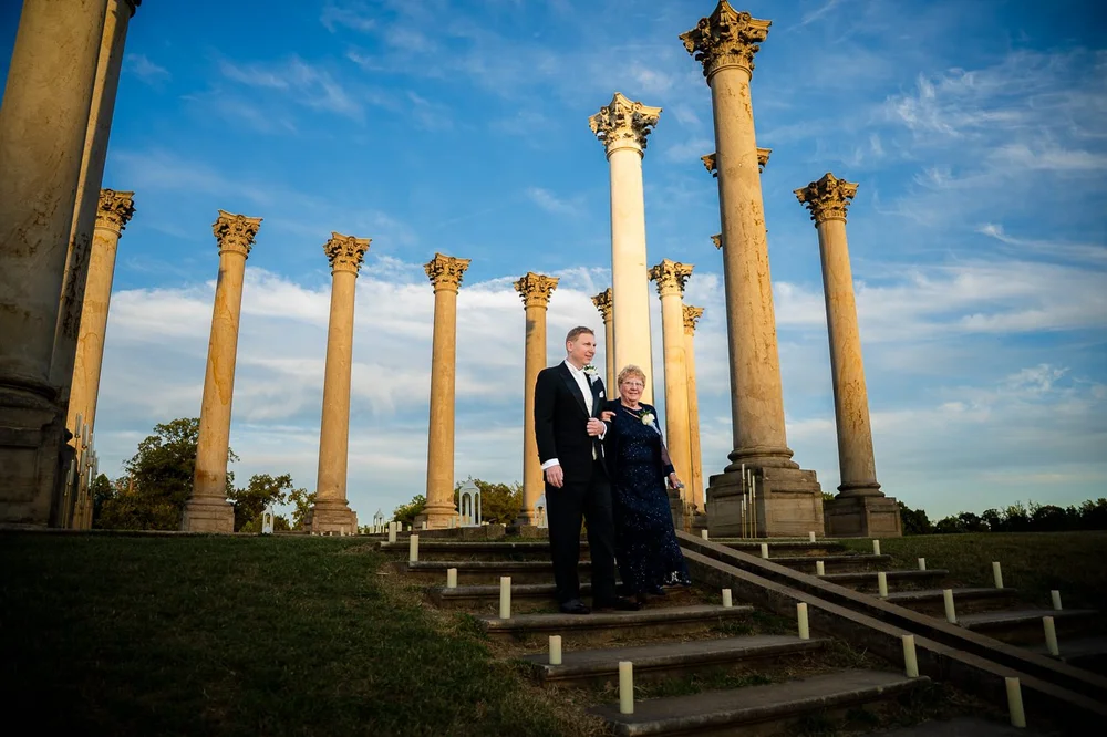 Groom and mother family portrait in front of the Capitol Columns at the National Arboretum