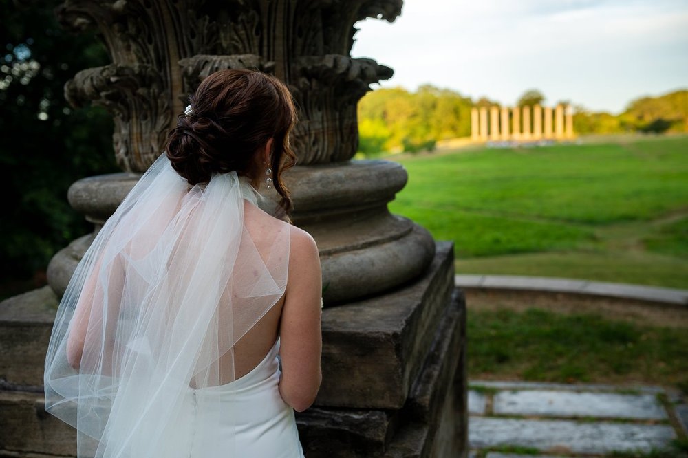 Bride veil portrait with a view of the Capitol Columns at the National Arboretum