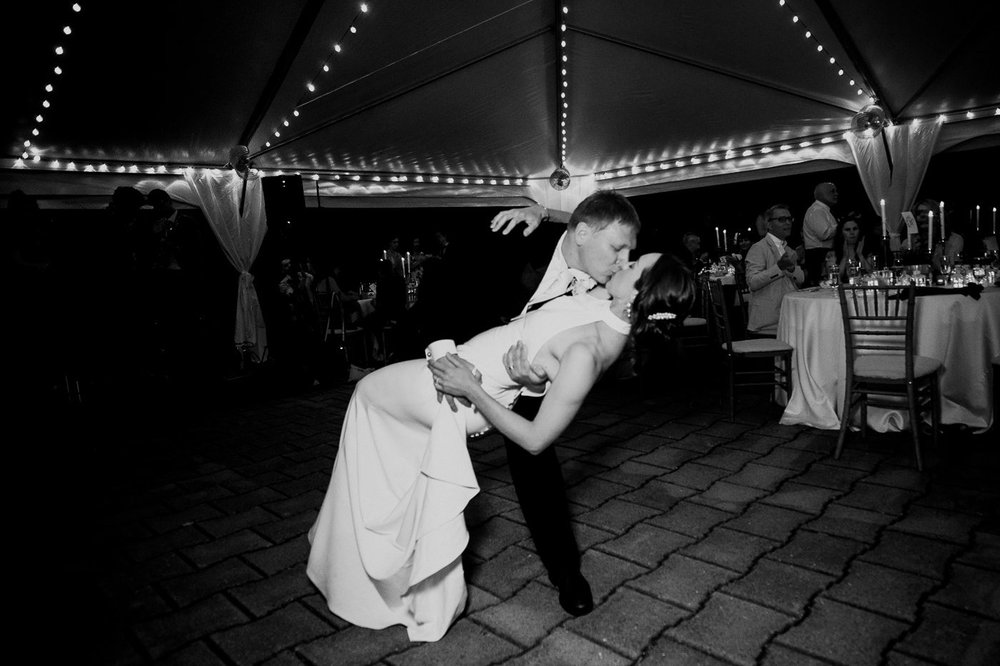 Bride and groom doing a dramatic dance dip during their National Arboretum wedding reception