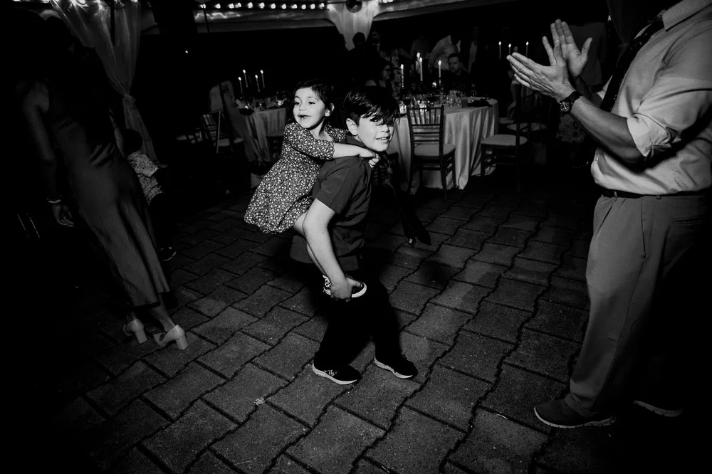 Children playing on the dance floor during a National Arboretum wedding reception