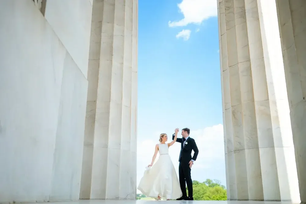 Couple dancing between grand columns on their Meridian House wedding day