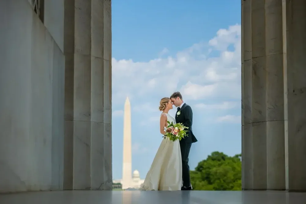 Couple with Washington Monument view on their Meridian House wedding day