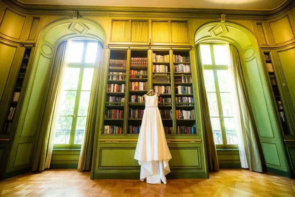 Elegant wedding gown displayed in the historic green library at Meridian House in Washington DC