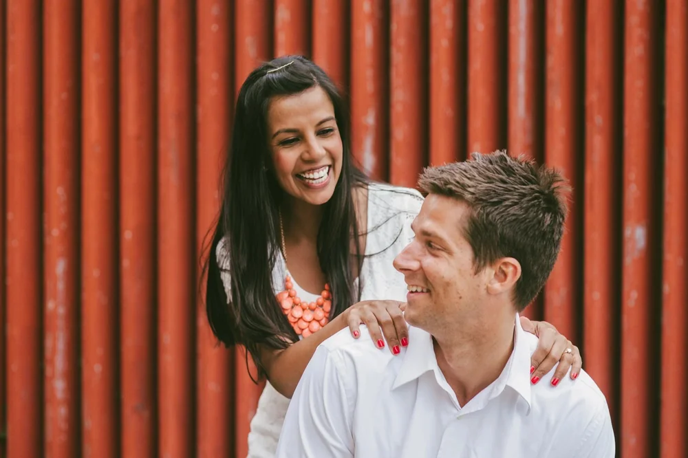 Happy couple laughing during downtown Annapolis engagement session