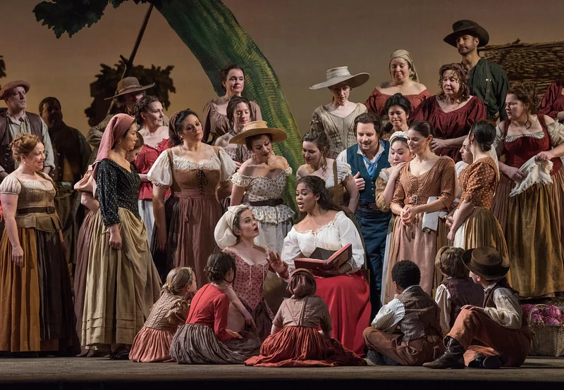 Adina reads about Tristan and Isotta; Nemorino and Giannetta listen...