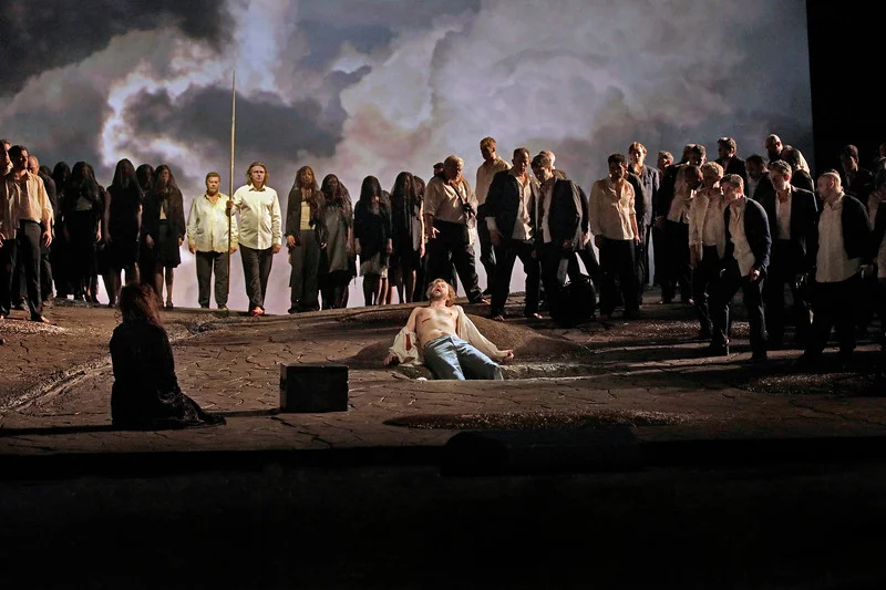Parsifal returns to heal Amfortas, who lies wounded in the foreground