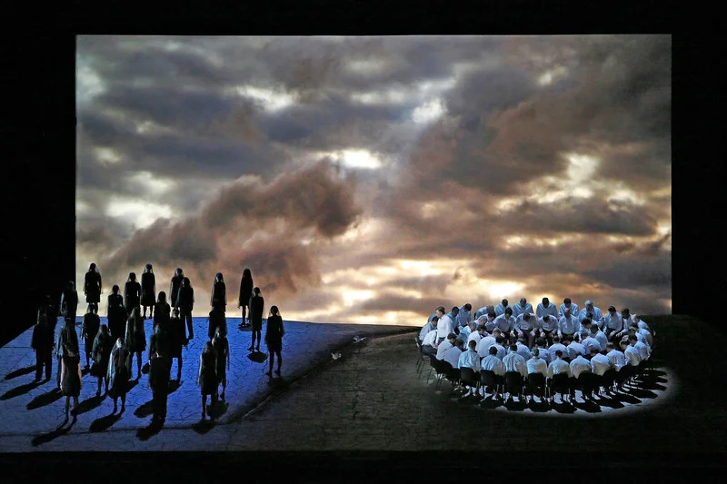 The women stand isolated to the left whilst the met pray on the right. Parsifal Act I