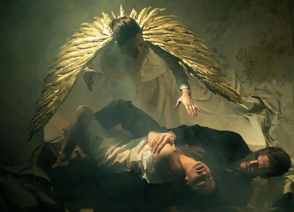 The Angel hovers over poor Tamara who is involved in at risk behavior with the Demon in Bard's production of The Demon