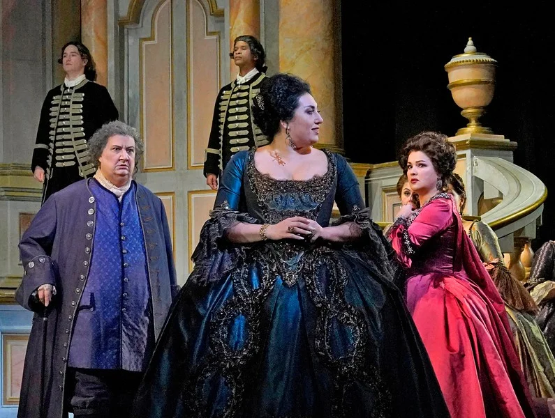 Adriana gives the Princess dirty looks as Michonnet looks on