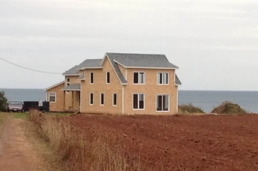 Builidings in Place, Siding and Windows Underway
