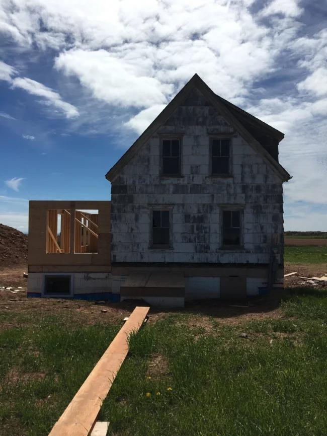 House Positioned on Foundation and Construction of Addition