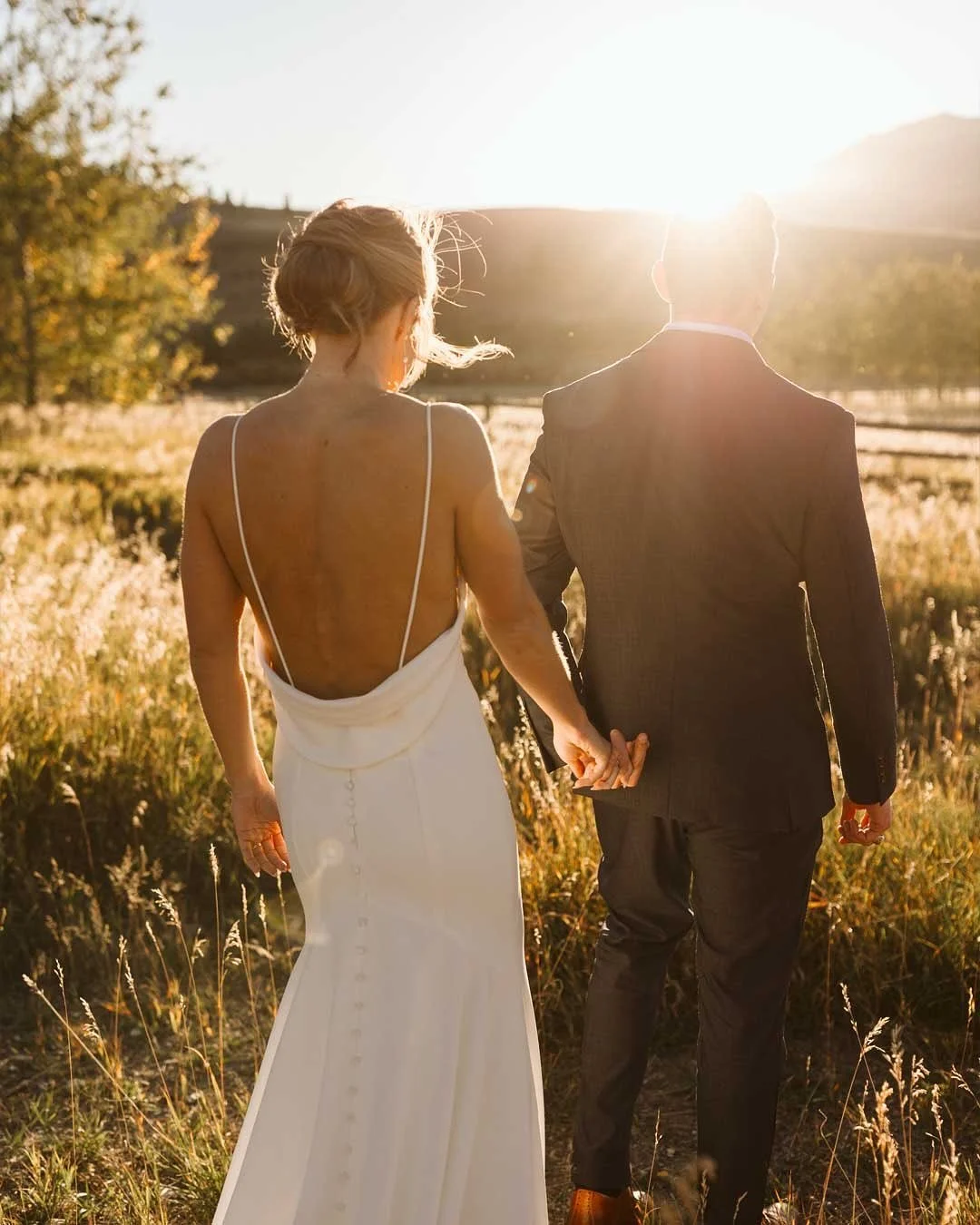 Amy + Aaron decided to get married on an intimate ranch just outside Yellowstone, where the Wi-Fi is weak, the vowels are strong, and the grizzly bears are plenty. (Not joking about the grizzlies. They named it Grizzly Creek Ranch for a reason. They 