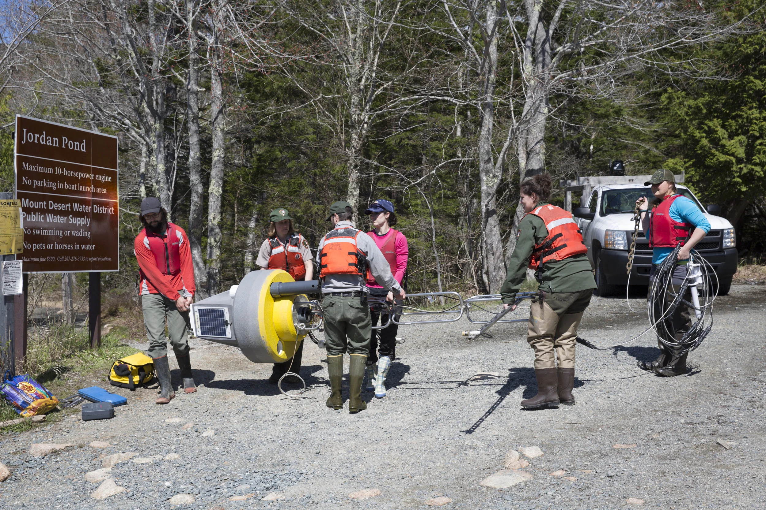All hands on deck! Loading the buoy into the Zodiac
