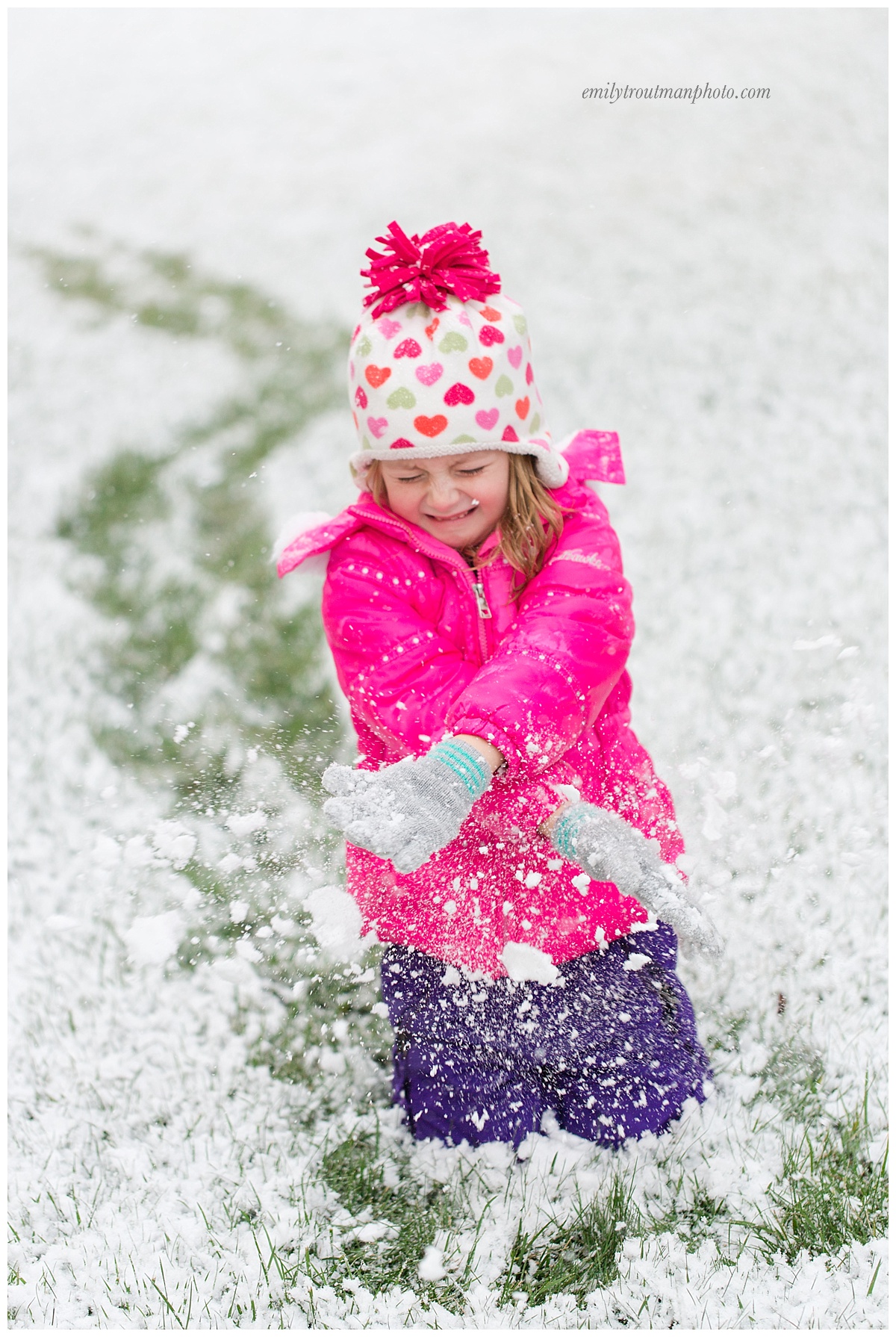 Love her expression which is SO her...she wants to have fun and throw snow but not get it in her face! 