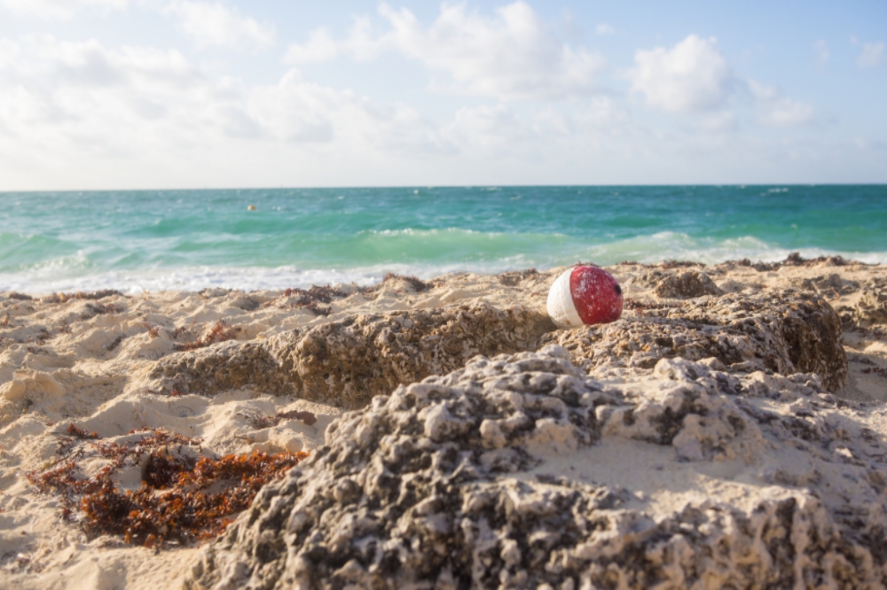 I spotted this washed up buoy a couple hours after sunrise in Grand Bahama with the sun high in the sky! Looks inviting doesn't it?!