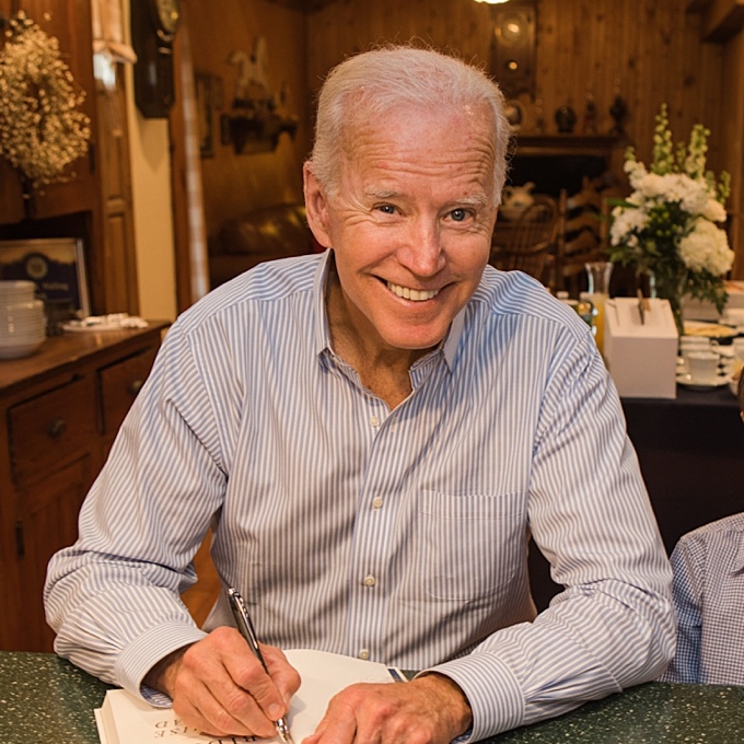 Signing copies of his book Promise Me Dad