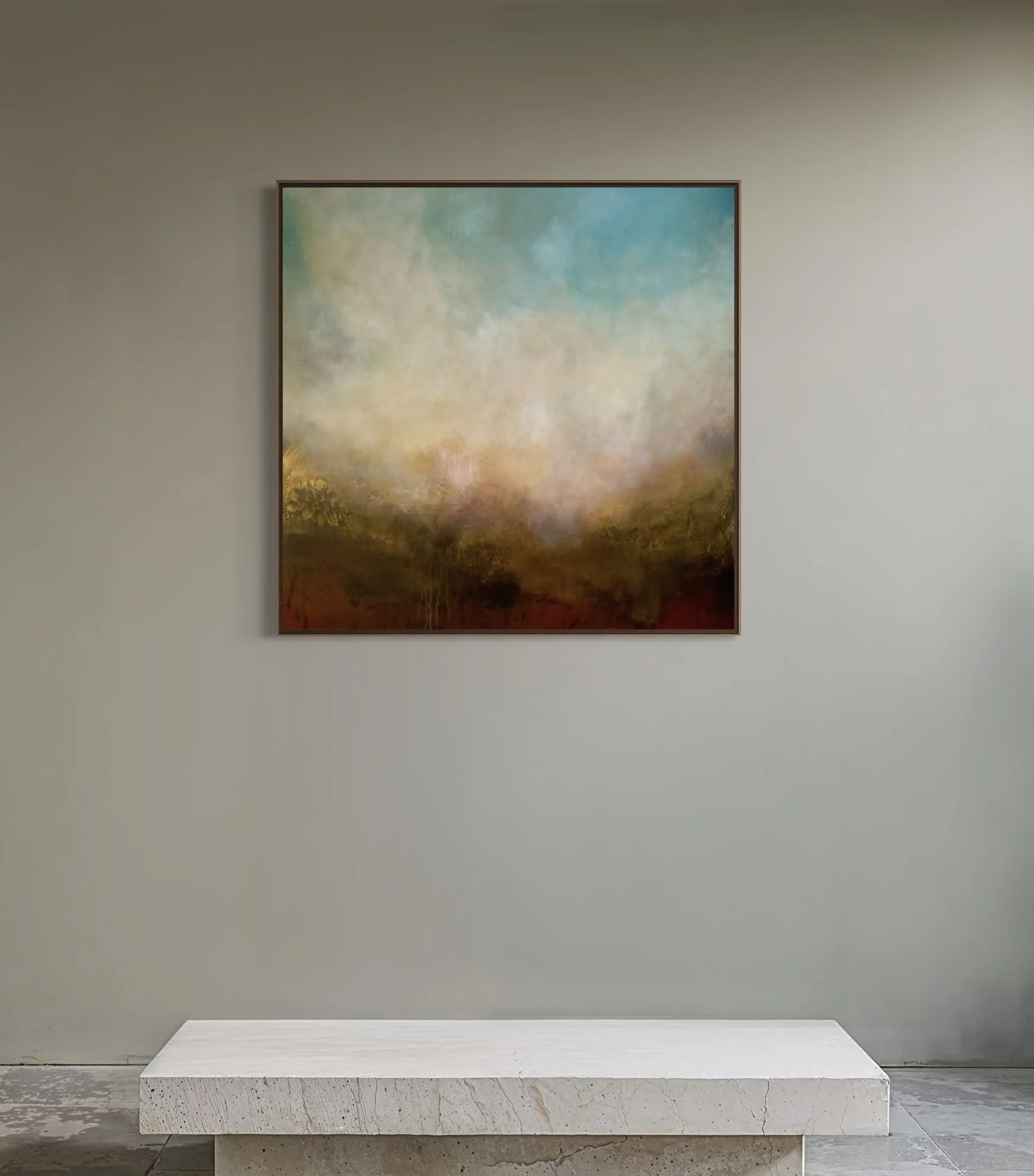 Abstract landscape painting with soft clouds, trees, and a hazy horizon, framed and hung on a neutral-colored wall above a white marble display surface.