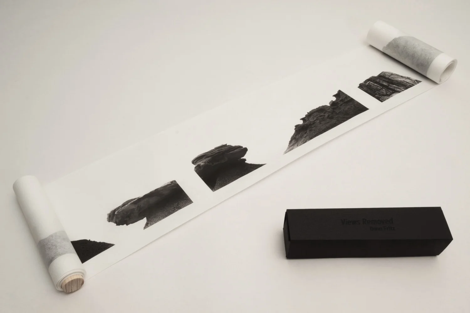 Signed, limited edition handscroll with ten 4"x10" images, title, and short text describing the work printed on Murakumo Kozo paper. This self-published artist's book bound by the artist brings the horizontal images from Views Removed into an handscroll format that encourages the viewer to choose the landscape view at arm's length, even combining multiple images into new landscapes.