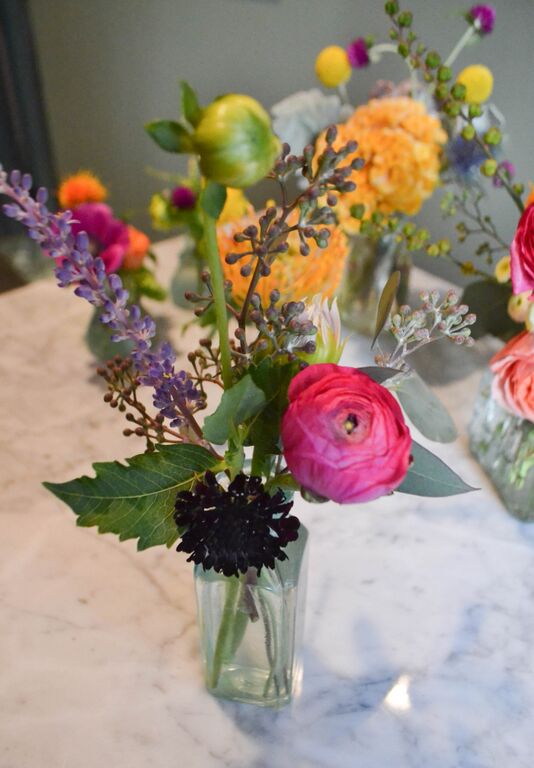 Bud vase arrangement in vintage aqua glass vase. Rosehip Social Brooklyn NY
