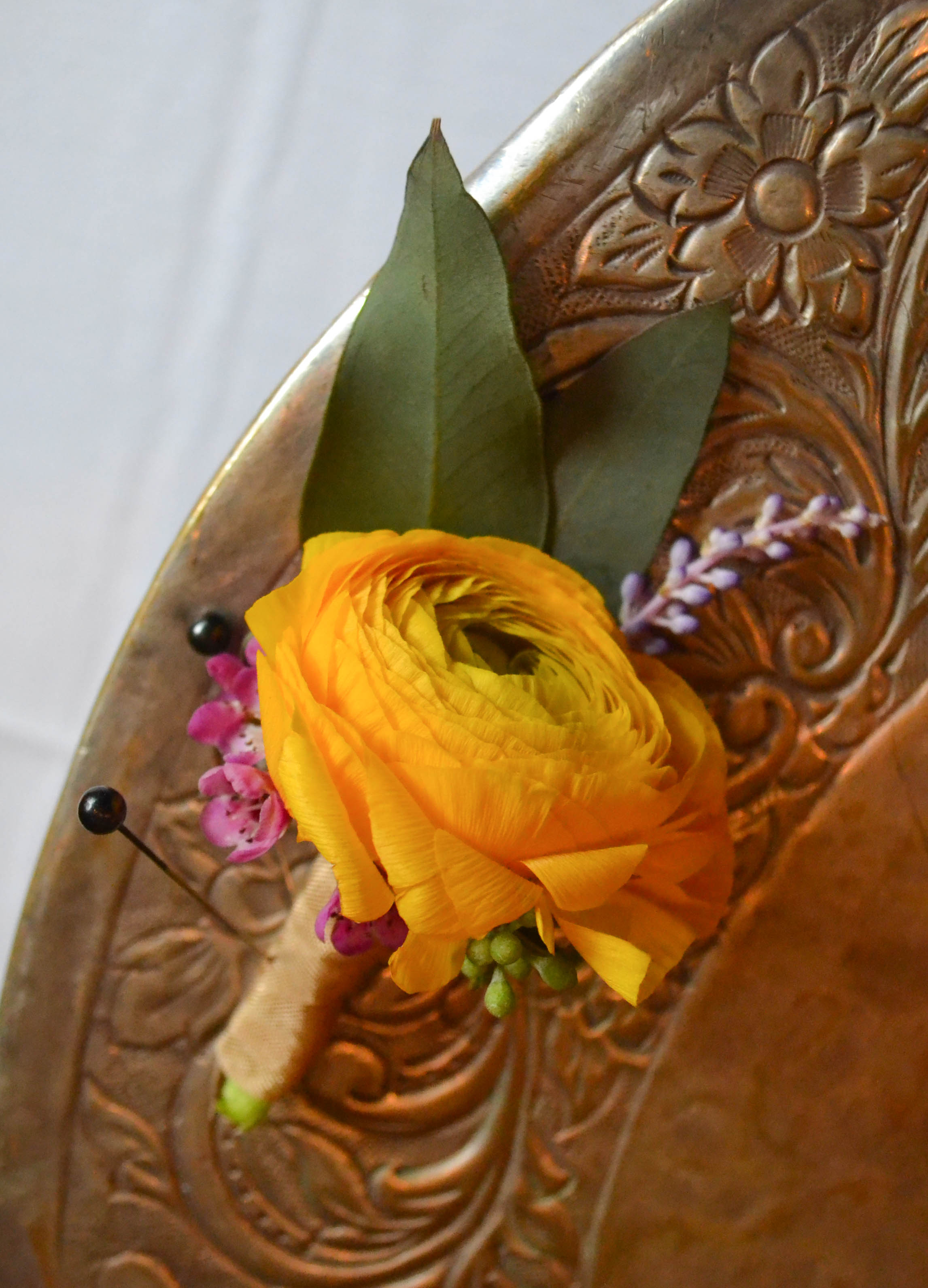 Yellow groom's boutoniere