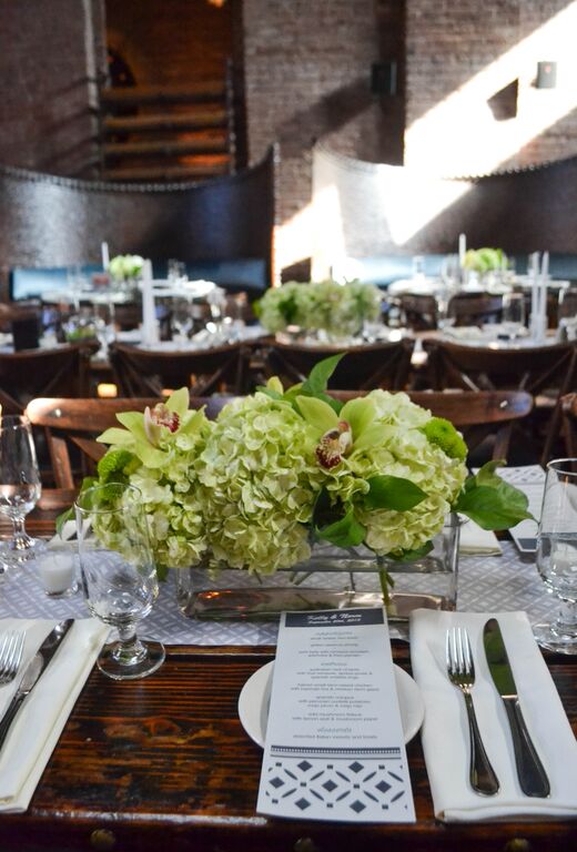 Green Cymbidium orchid and hydrangea centerpieces at MyMoon. Rosehip Social, Brooklyn, NY.