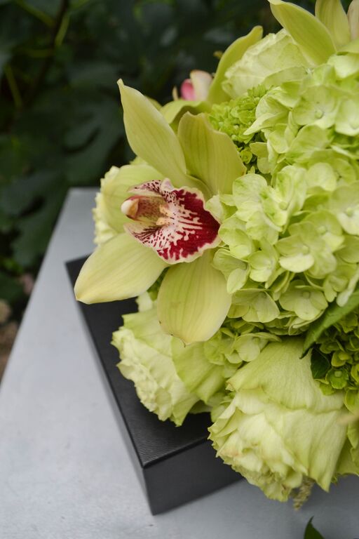 Green Cymbidium orchid and hydrangea bridal bouquet. Rosehip Social, Brooklyn, NY.