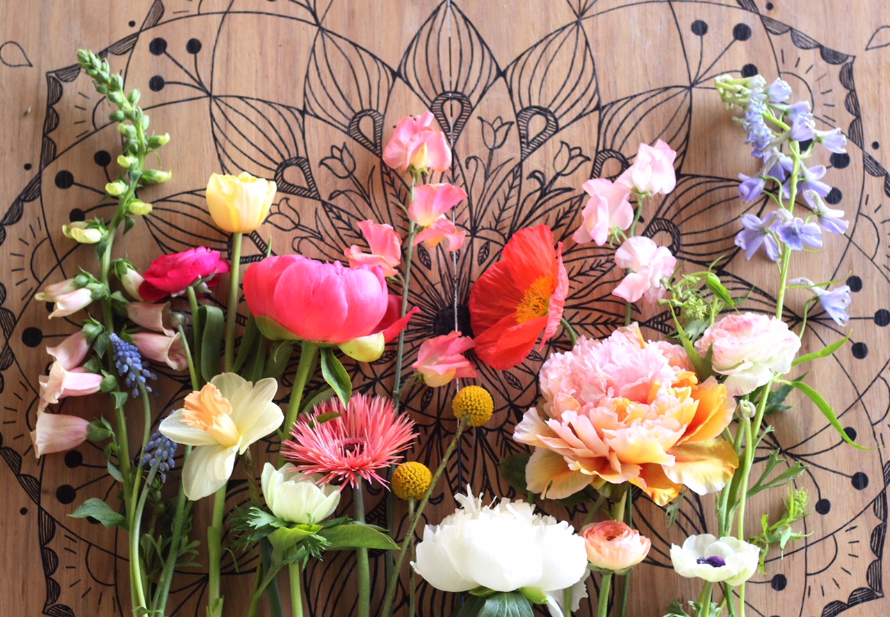 From left: foxglove, grape hyacinth, ranunculus, tulip, narcissus, peony, anemone, spider gerbera daisy, sweet pea, craspedia, poppy, tree peony, delphinium.