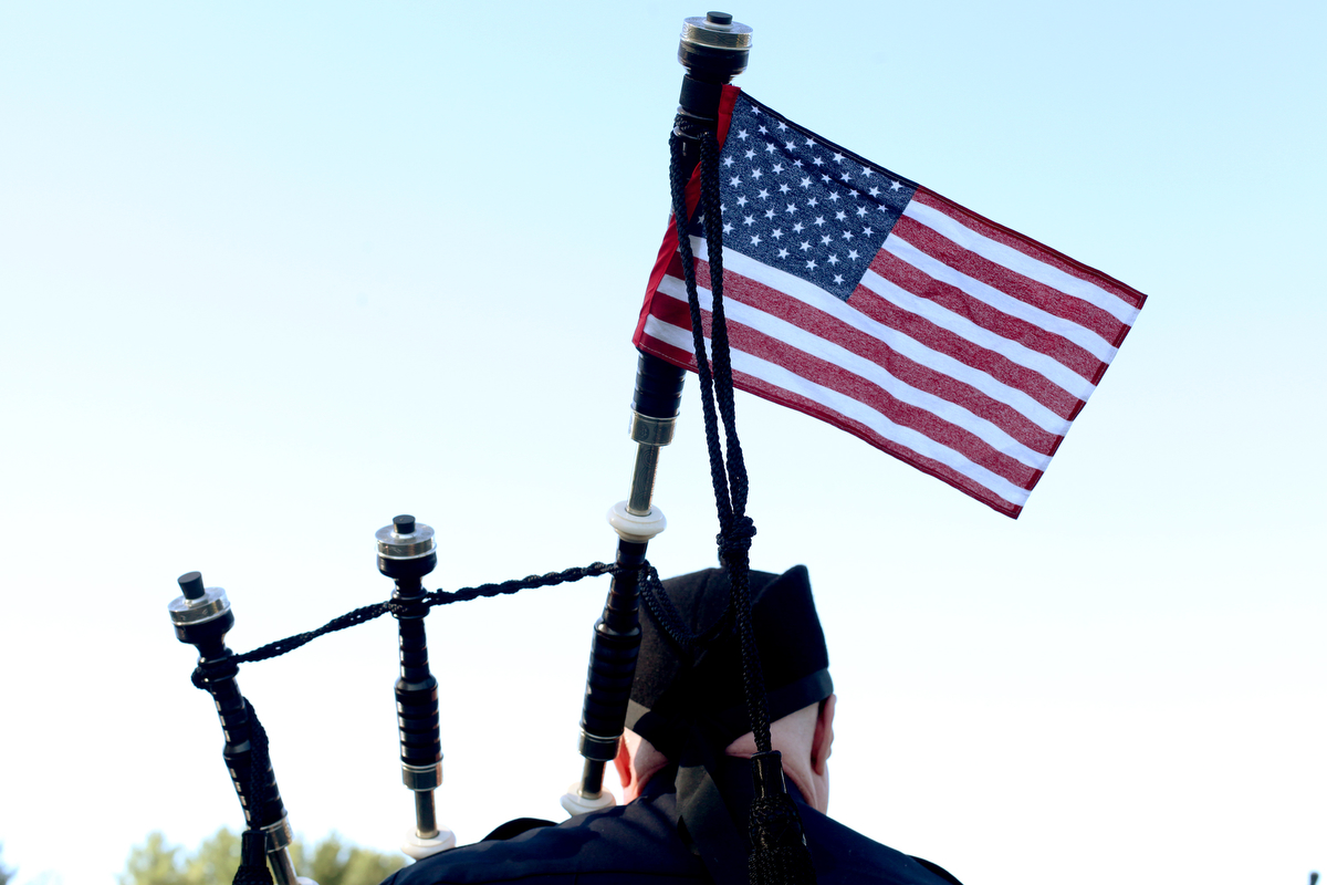 Members of the New Hampshire Police Association Pipes and Drums practice before a procession to the memorial service for Brentwood police officer Stephen Arkell at Exeter High School on Wednesday, May 21, 2014. Arkell, 48, was shot and killed while responding to a domestic disturbance call on May 12. 