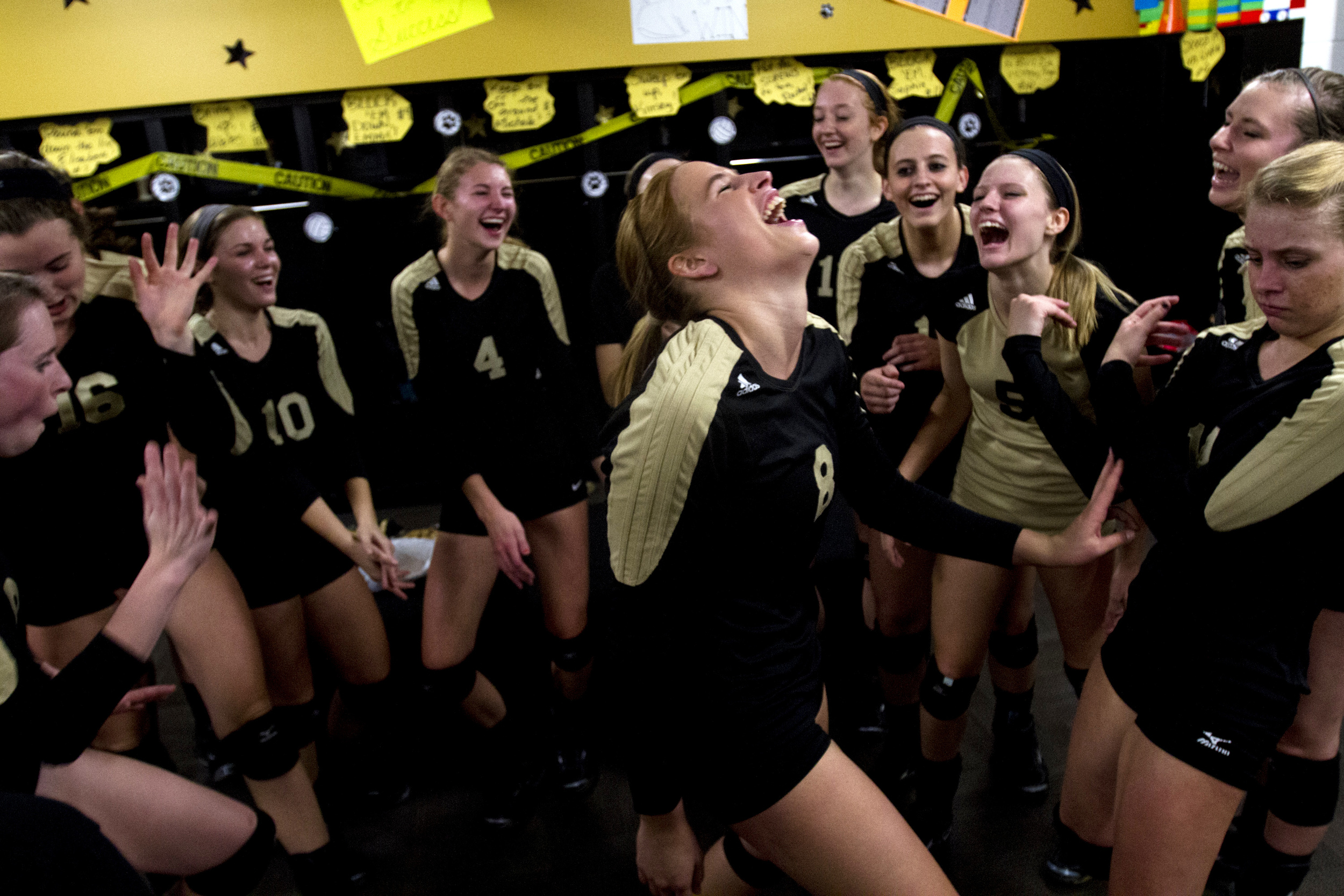  Jasper's Tori Sermersheim dances with her teammates in the locker room before the Class 3A girls volleyball sectional against Washington in Jasper, Ind. on Oct. 24, 2013. &nbsp;The Wildcats won in three sets. 