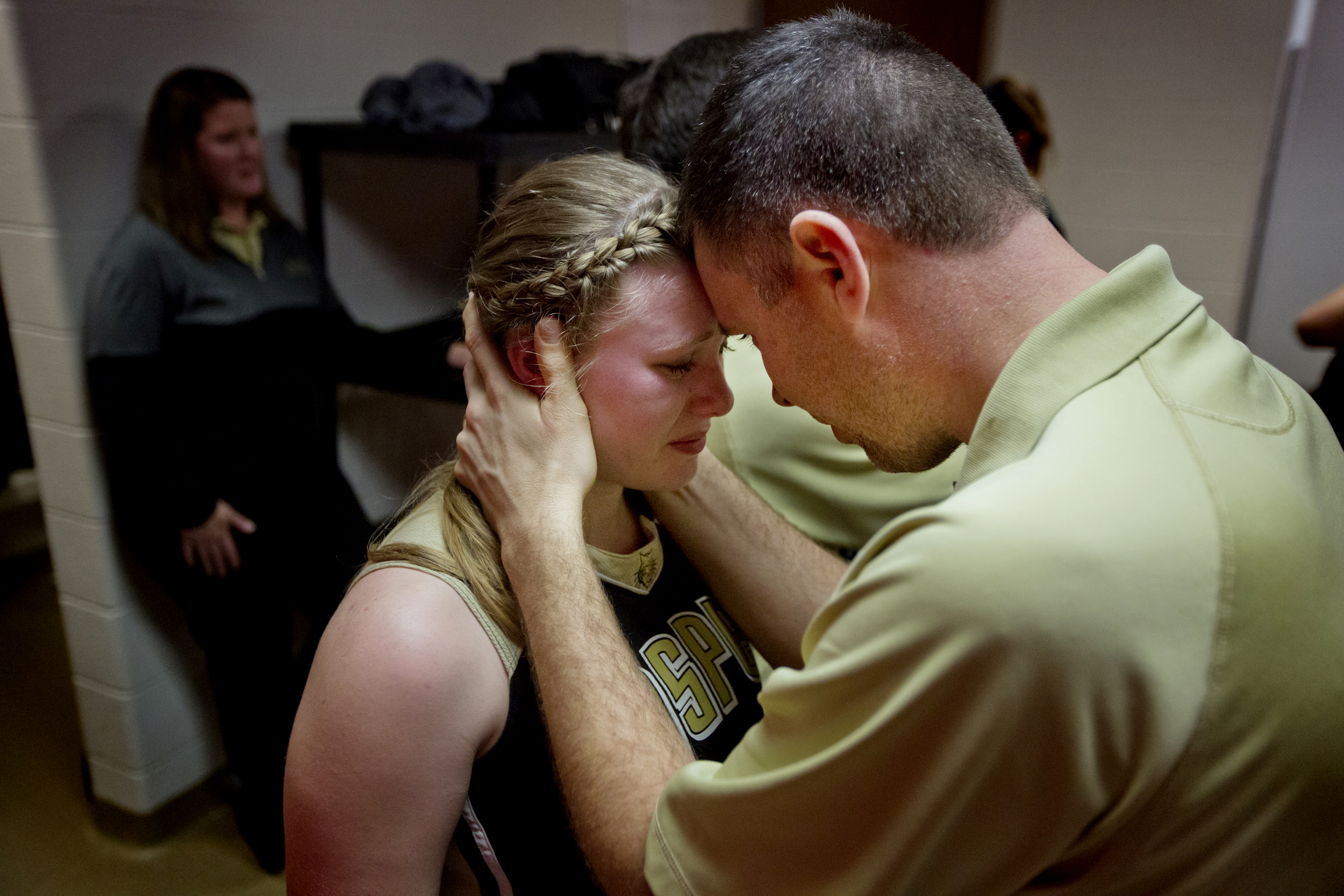  Jasper coach Ryan Erny tells senior Regan Hedinger that he is proud of her after Jasper lost the Class 3A girls basketball sectional semifinal to Vincennes Lincoln in Princeton, Ind. on Feb. 5, 2016. The Wildcats lost 47-26. 