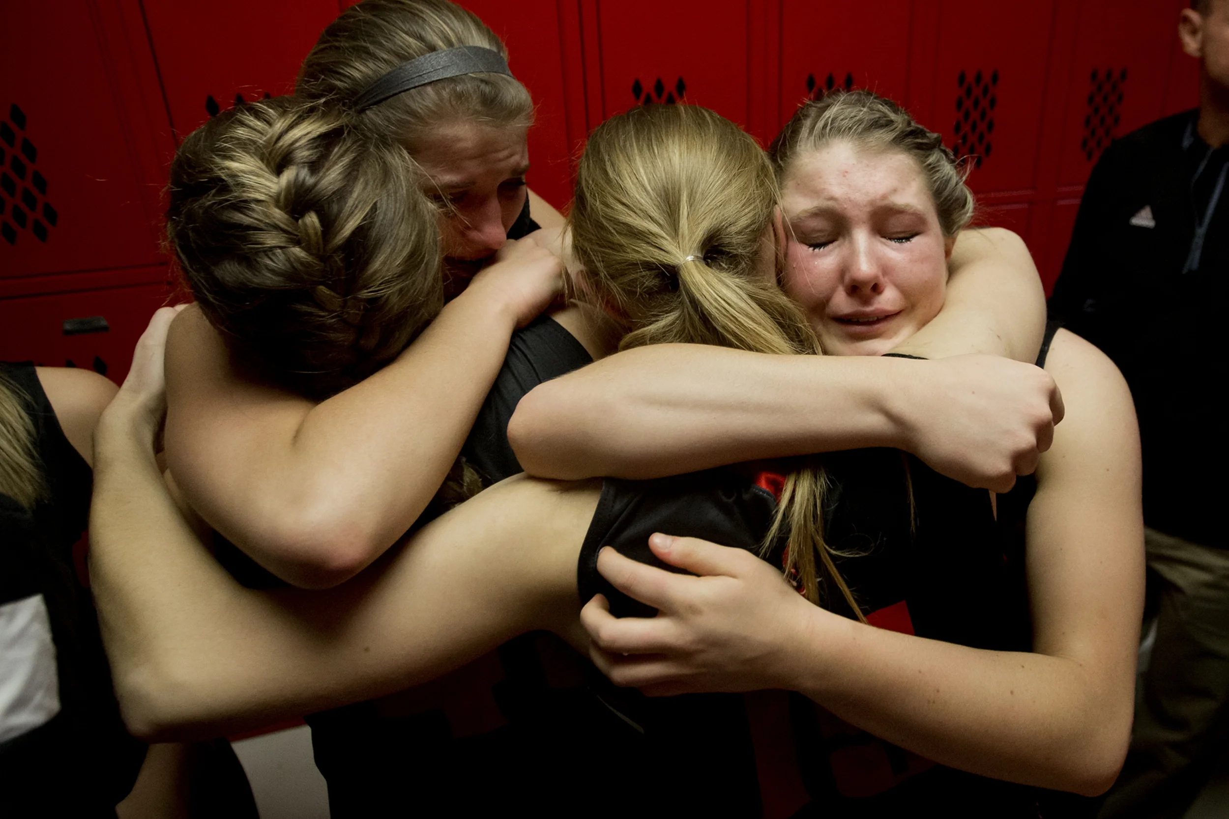  Southridge's Tori Tretter, right, Kadie Dearing, Taylor Neukam and Kendyl McKeough comfort each other after losing to Vincennes Lincoln in the Class 3A girls basketball sectional championship in Princeton, Ind. on Feb. 6, 2016. The Raiders lost 48-3