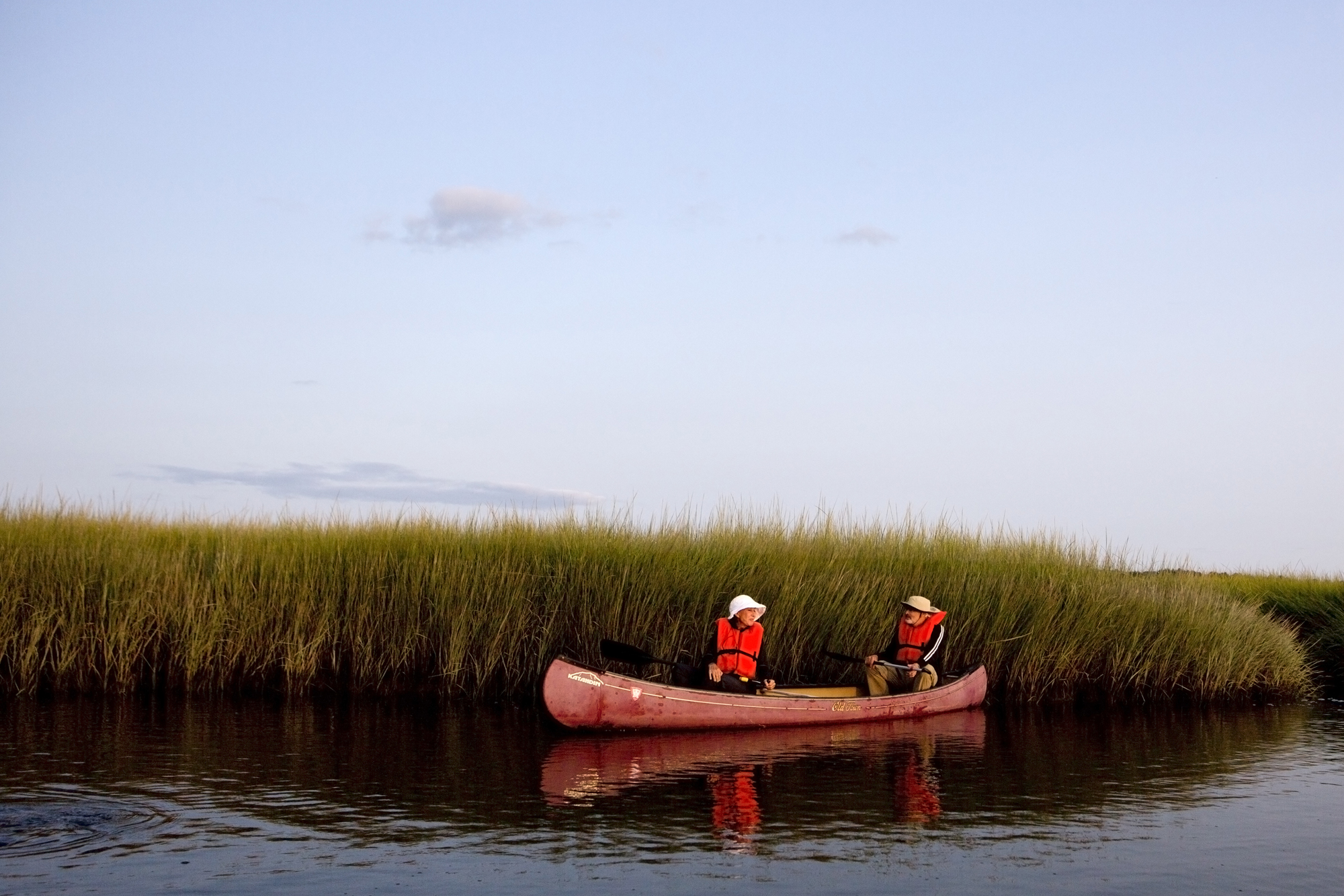  Canoers look for birds and other marsh life during a sunset canoe tour at the Scarborough Marsh Nature Center in Scarborough, Maine on August 25. 