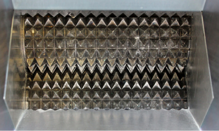 SSD media are crushed between two rotating hardened pyramid shafts.