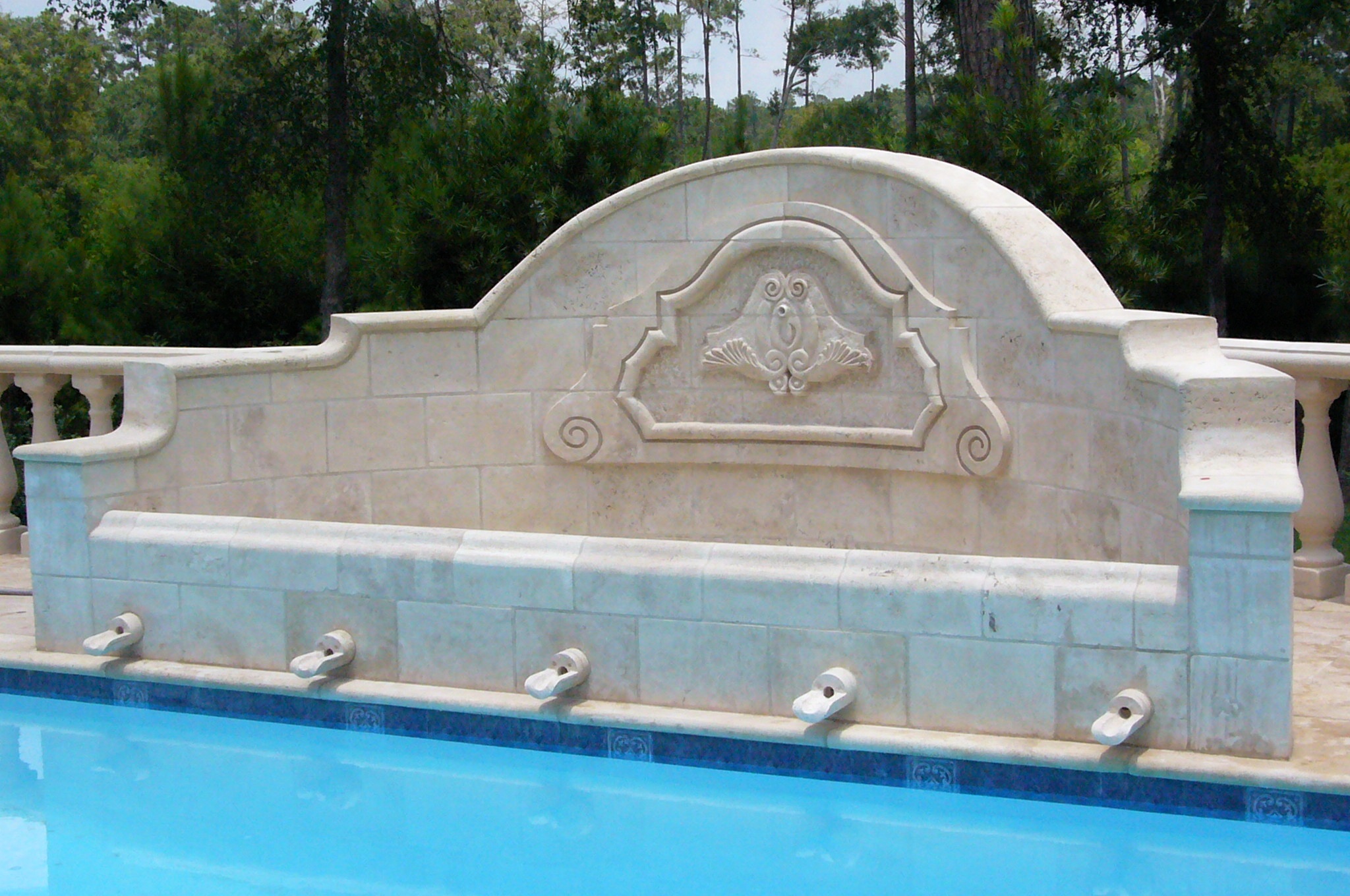 Stone fountain with carving