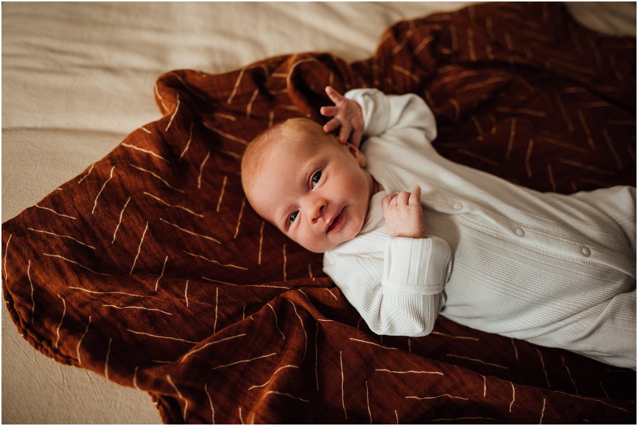 Kelly Lovan Photography | newborn photography southern indiana | newborn lifestyle photo ideas | newborn photo on bed 