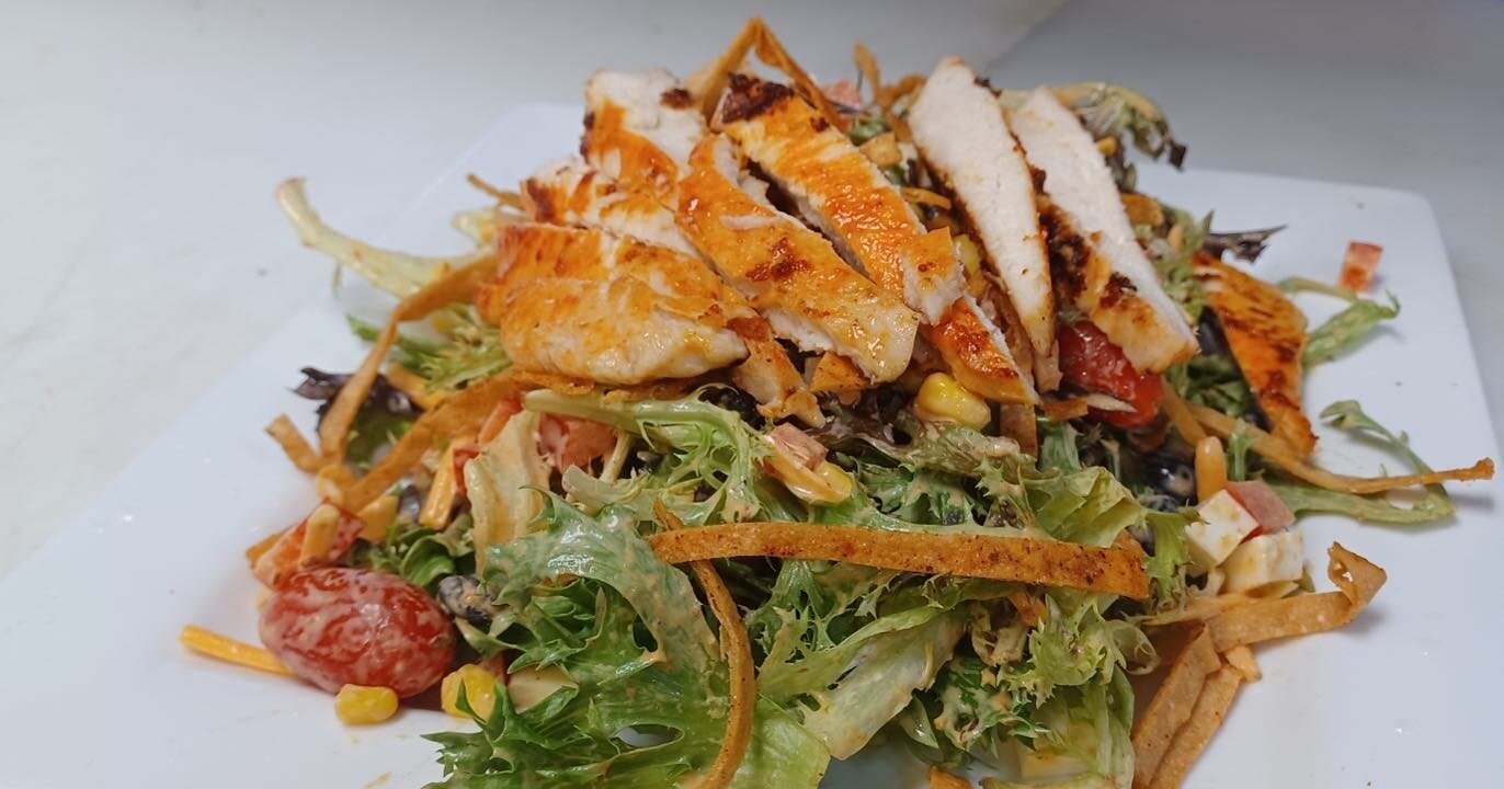 This week at Melt we are featuring a speciality salad by our own Chef Alex. The Santa Fe chicken salad. This salad has tomatoes, corn, black beans, red peppers, cheddar cheese, tortilla strips, queso fresco, blackened chicken tossed in chipotle dress
