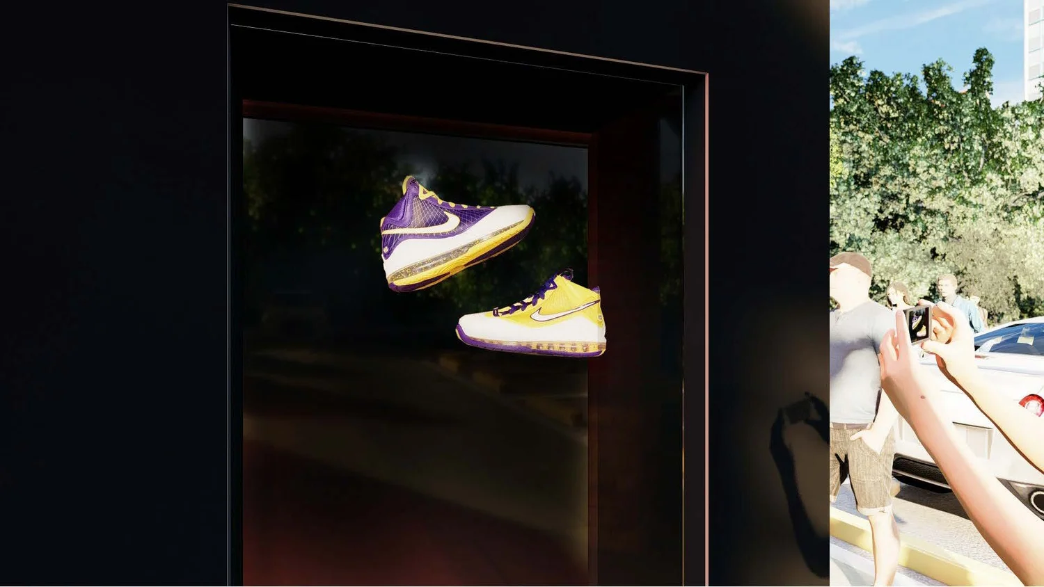 Display case with two sneakers, one purple and yellow and the other yellow and white, outside on a sunny day with trees and people in the background.
