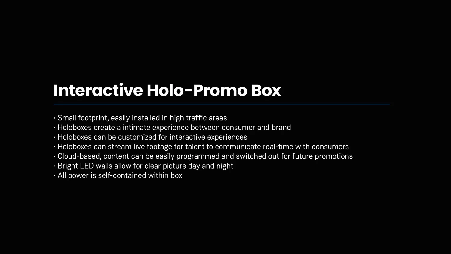 A presentation slide titled 'Interactive Holo-Promo Box' with bullet points highlighting features such as small footprint, immersive experience, customizable content, live streaming, cloud-based, bright LED walls, and self-contained power.