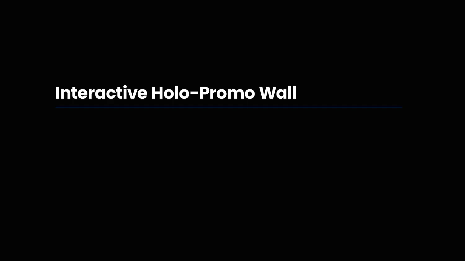 Slide titled 'Interactive Holo-Promo Wall' with a black background and white text.