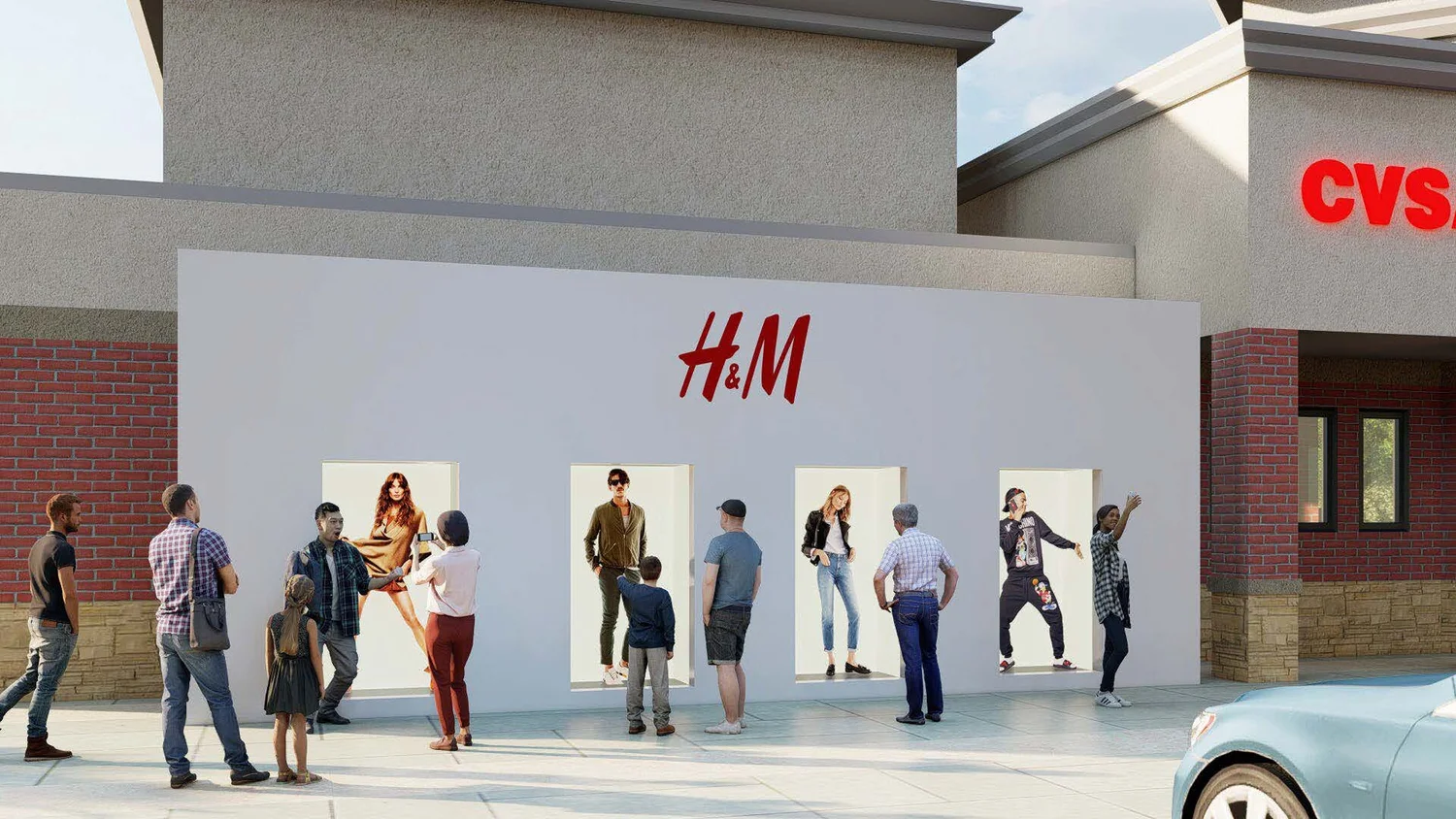 People viewing clothing displays outside an H&M store during daytime.