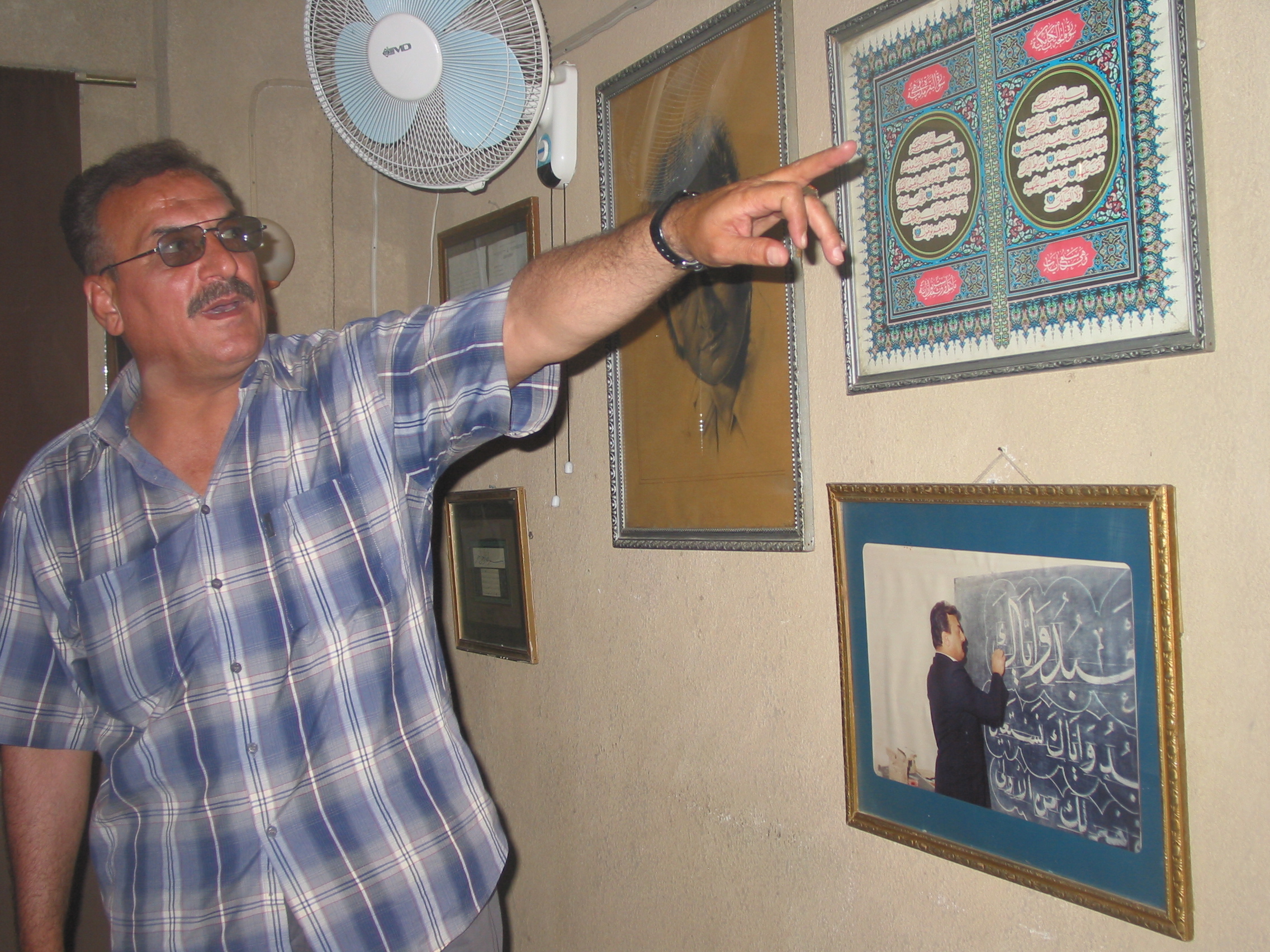 Celebrated calligrapher Abbas Baghdadi displays his work in his home in the Baghdad suburbs.